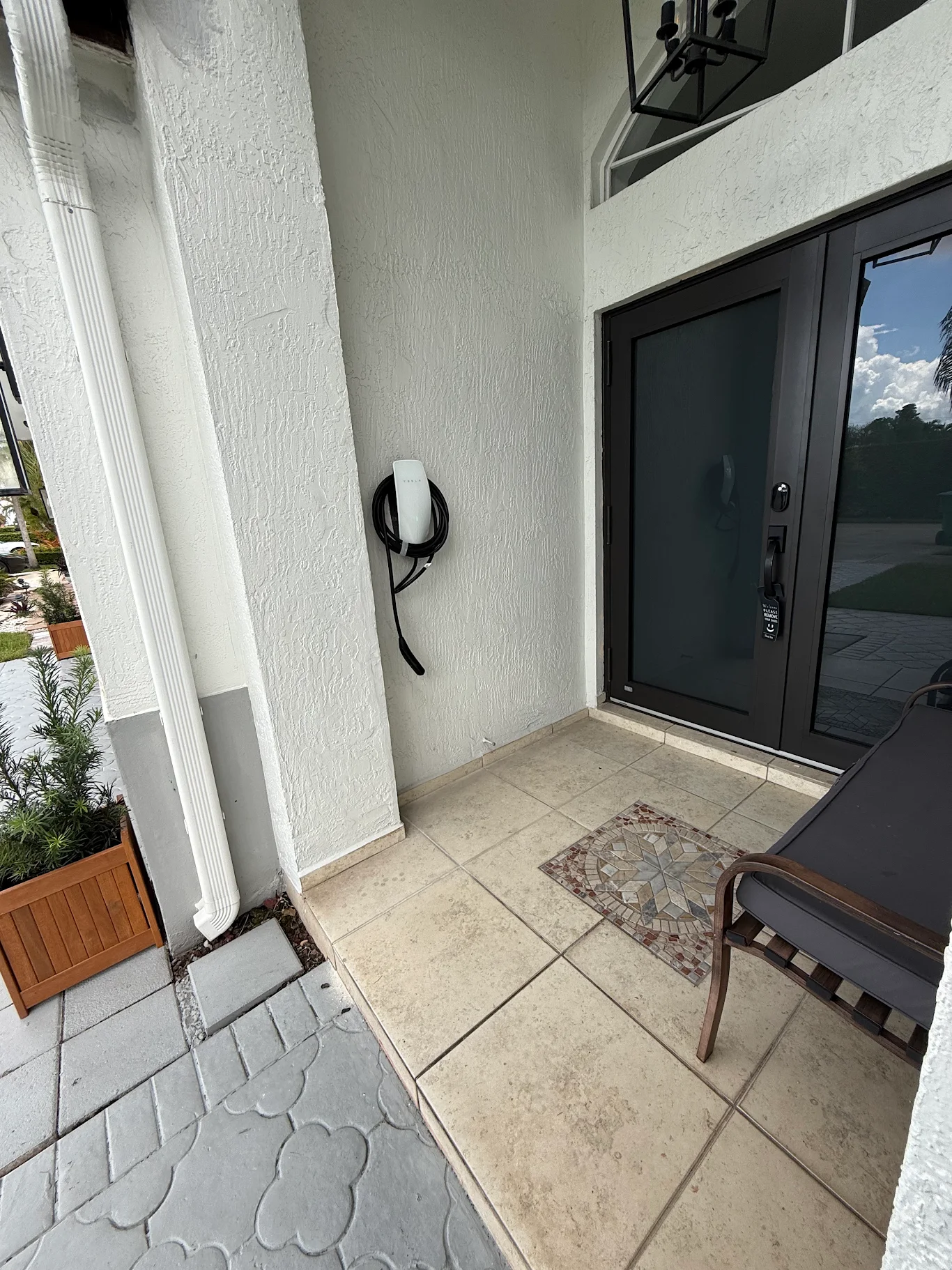 EV charger installed beside a home's front entry