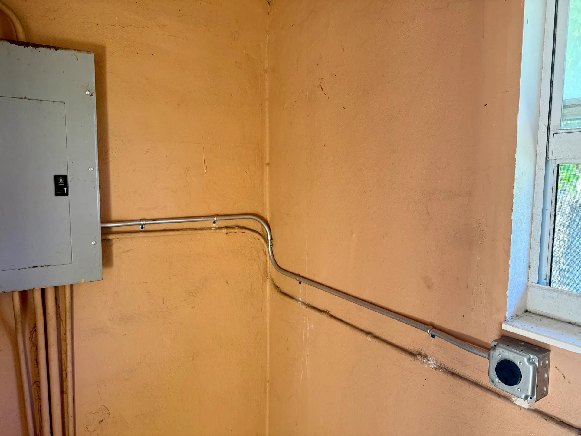 Dedicated circuit run in conduit from a panel to a new receptacle